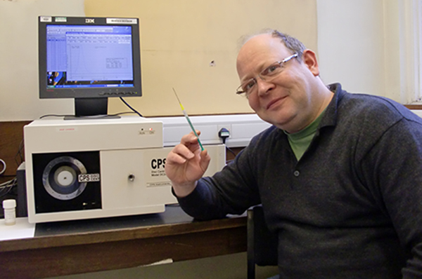 Professor Mathias Brust prepares a sample for the CPS Disc Centrifuge